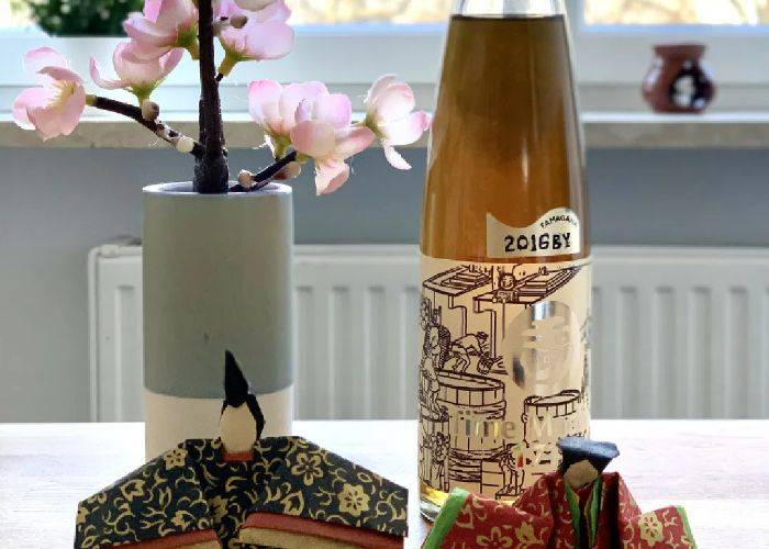 A bottle of umeshu at a sake tasting experience in Shibuya.